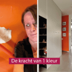 VROUW KIJKT VERSCHRIKT NAAR GAT IN ORANJE MUUR
